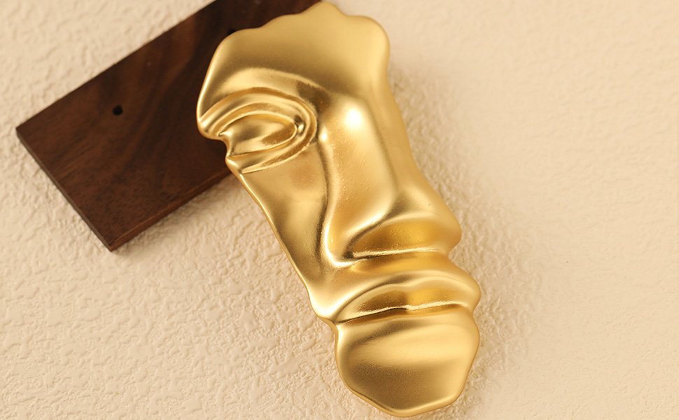 gold mask brooch