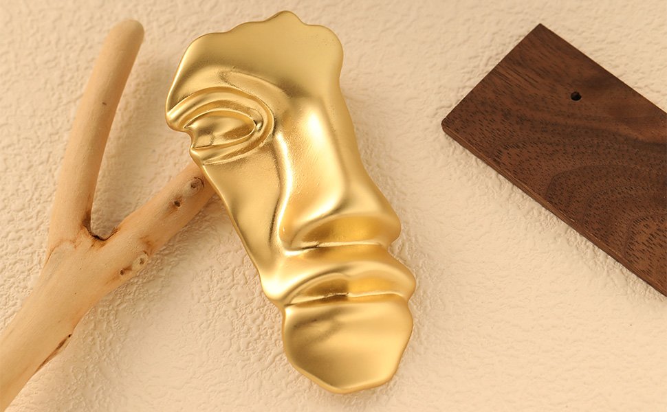 gold mask brooch